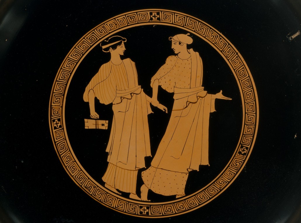 Two girls with a writing tablet, pictured on a terracotta kylix.